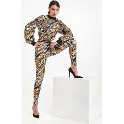 Legginsy VERSACE JEANS COUTURE. Białe legginsy Versace Jeans Couture, bez wzorów, z jeansu. W wyprzedaży za 443.40 zł.