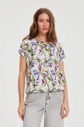 Bluzka w kwiaty biała. Białe bluzki MOODO, l, bez wzorów, z elastanu, bez kołnierzyka, bez ramiączek. Za 79.99 zł.