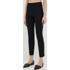Liviana Conti legginsy damskie kolor czarny gładkie. Czarne legginsy Liviana Conti, bez wzorów, z dzianiny. W wyprzedaży za 384.99 zł.