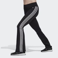 Legginsy treningowe damskie adidas Training Essentials Flared Tights. Czarne legginsy adidas, bez wzorów, z materiału, sportowe. W wyprzedaży za 207.65 zł.