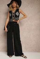 Czarne Spodnie z Bawełną o Szerokim Kroju High Waist Ozdobione Guzikami Morritia. Czarne jeansy Renee, bez wzorów, z bawełny, eleganckie, z podwyższonym stanem. W wyprzedaży za 39.99 zł.