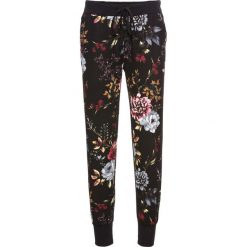 Spodnie dresowe bonprix czarny w kwiaty. Spodnie dresowe marki Nike. Za 79.99 zł.