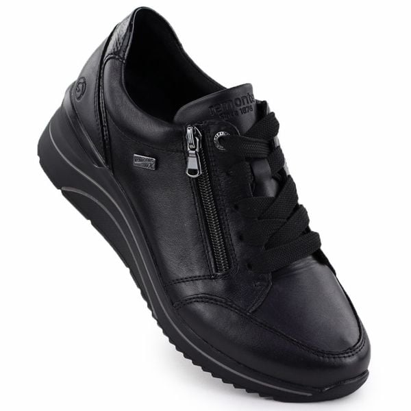 Skórzane wodoodporne półbuty damskie na koturnie czarne Rieker Remonte D0T03-00. Czarne półbuty wsuwane Rieker, bez wzorów, ze skóry, bez obcasa, na koturnie. Za 343.20 zł.