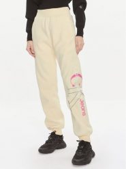Calvin Klein Jeans Spodnie dresowe Bold Monologo J20J222606 Żółty Relaxed Fit. Żółte spodnie dresowe Calvin Klein Jeans, bez wzorów, z bawełny. Za 269.99 zł.