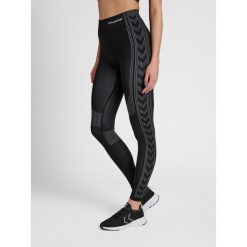 Damskie legginsy ze średnim stanem Hummel Shaping. Czarne legginsy Hummel, bez wzorów, z materiału, sportowe. Za 130.50 zł.