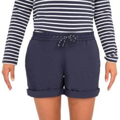 Szorty żeglarskie damskie Tribord Sailing 100. Niebieskie szorty TRIBORD, bez wzorów, z bawełny, sportowe. W wyprzedaży za 39.99 zł.
