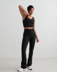 Damskie legginsy rozszerzane z wysokim stanem dla wysokich czarne. Czarne legginsy AIM'N, bez wzorów, z elastanu, długie. Za 344.00 zł.