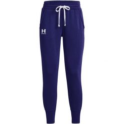 Spodnie fitness damskie Under Armour Rival Fleece Joggers. Niebieskie spodnie sportowe Under Armour, bez wzorów, na fitness i siłownię. Za 191.88 zł.