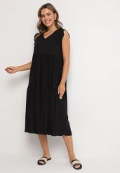 Czarna Bawełniana Sukienka Ozdobiona Falbankami Aveliova. Czarne sukienki Born2be, na co dzień, l, bez wzorów, z bawełny, eleganckie, bez kołnierzyka, bez ramiączek, midi, proste. W wyprzedaży za 50.99 zł.
