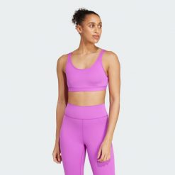 Biustonosz All Me Essentials Medium-Support. Czarne biustonosze sportowe adidas, bez wzorów, z materiału, na jogę i pilates. Za 170.50 zł.