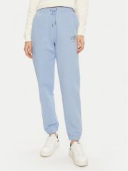 Guess Spodnie dresowe W5RB63 K68I4 Niebieski Regular Fit. Niebieskie spodnie dresowe Guess, z aplikacjami, z bawełny. Za 169.99 zł.