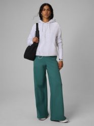 4F Spodnie dresowe z szerokimi nogawkami damskie - turkusowe XS. Niebieskie spodnie sportowe 4f, bez wzorów, z bawełny, do biegania. Za 149.99 zł.