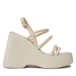 Sandały Melissa. Brązowe sandały Melissa, bez wzorów, bez obcasa, na koturnie, bez zapięcia. Za 419.99 zł.
