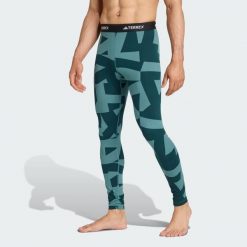 Legginsy bazowe Multi Synthetic Base Layer. Niebieskie legginsy adidas, bez wzorów, sportowe. W wyprzedaży za 142.35 zł.