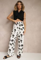 Białe Szerokie Spodnie High Waist w Kwiatowy Wzór Elsedia. Białe jeansy Renee, l, bez wzorów, z jeansu, eleganckie, z podwyższonym stanem. W wyprzedaży za 29.99 zł.