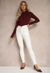 Białe Skinny Jeansy z Bawełną High Waist Lorie. Białe jeansy Renee, bez wzorów, z bawełny, eleganckie, z podwyższonym stanem. W wyprzedaży za 47.99 zł.