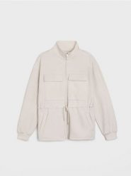 Rozpinana bluza ze stójką z dodatkiem wiskozy "soft touch" - kremowy. Białe bluzy Sinsay, l, bez wzorów, z wiskozy, bez ramiączek, bez kaptura. Za 69.99 zł.